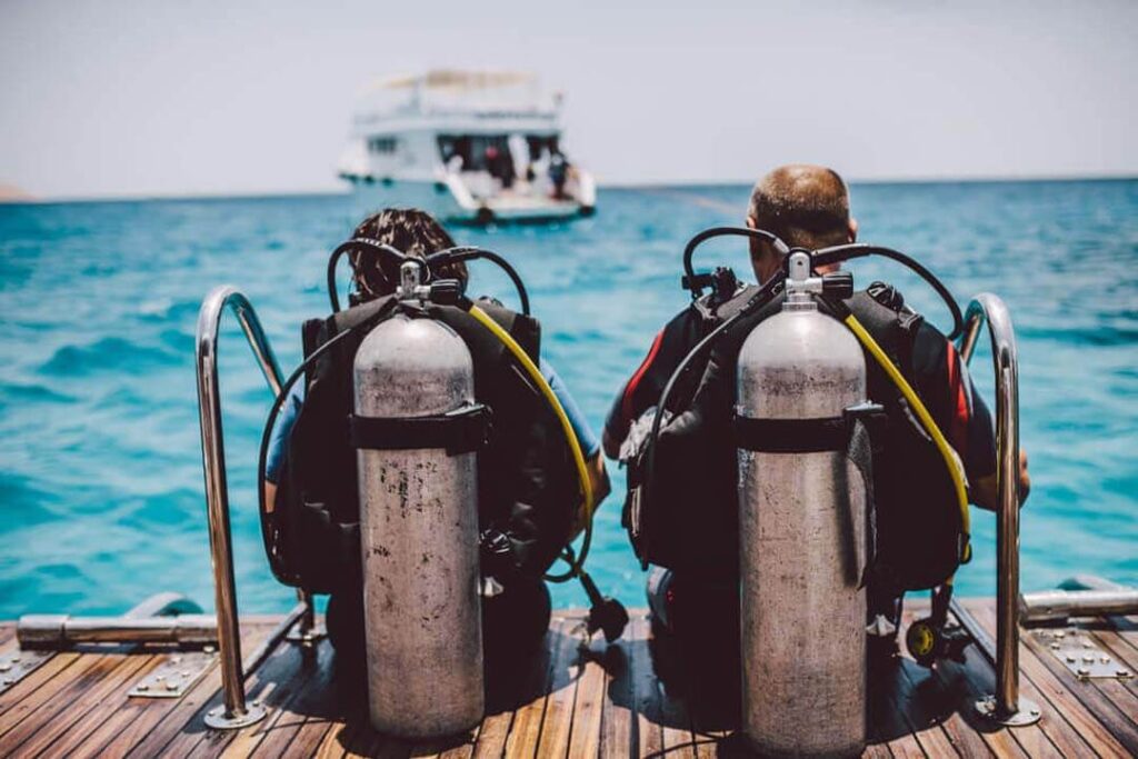 A man and his daughter are ready to try scuba diving in Hurghada.